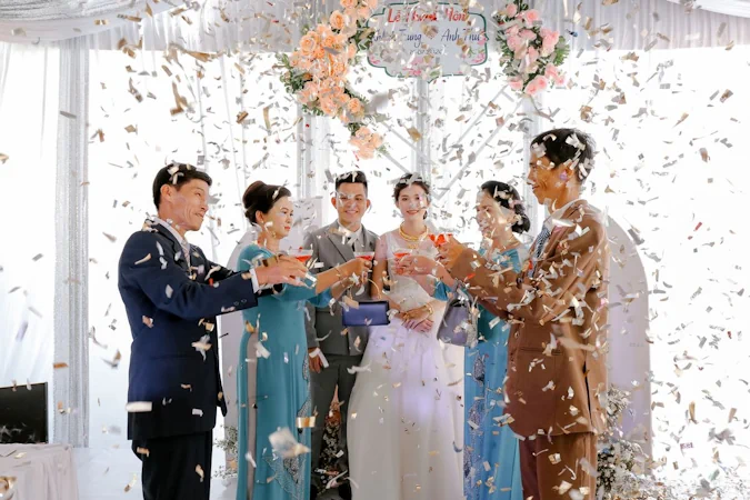 Newlyweds toasting with their families on the wedding day